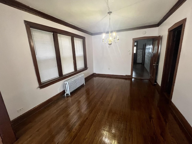 unfurnished dining area featuring dark hardwood / wood-style flooring, a notable chandelier, crown molding, and radiator heating unit