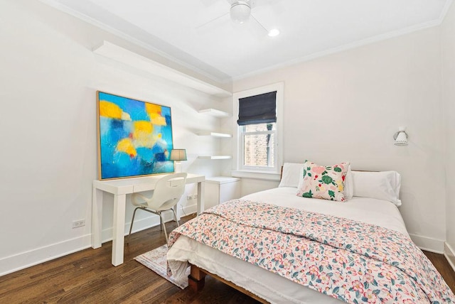 bedroom with dark wood-type flooring, ornamental molding, and ceiling fan