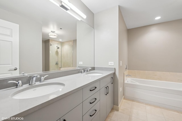 bathroom featuring tile patterned flooring, vanity, and independent shower and bath