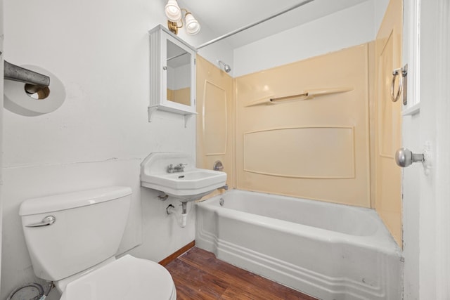 bathroom featuring wood-type flooring, toilet, and sink