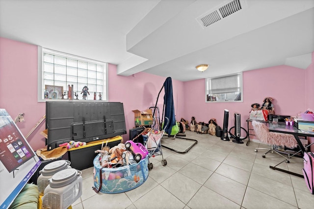 playroom featuring light tile patterned floors