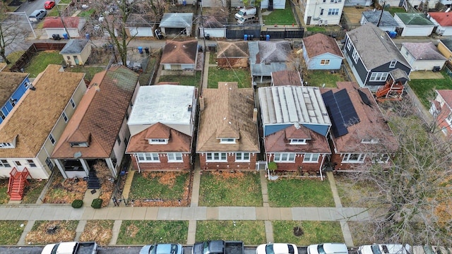 birds eye view of property with a residential view