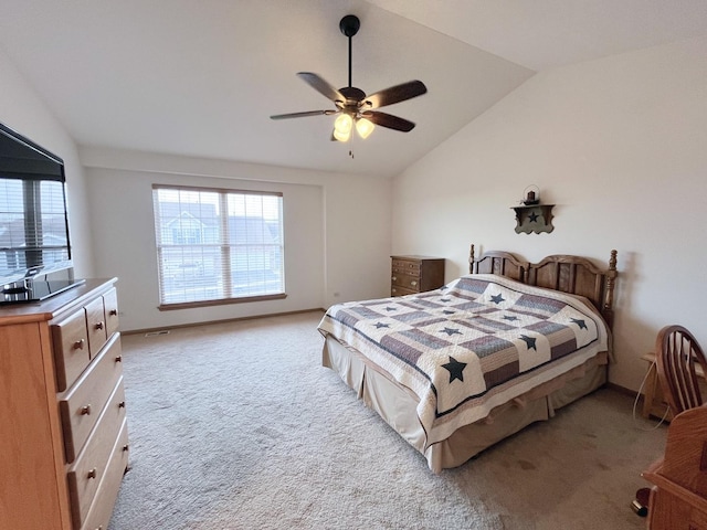 carpeted bedroom featuring ceiling fan and vaulted ceiling