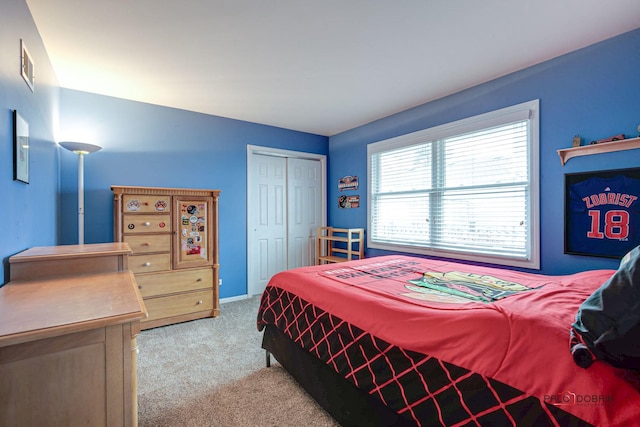 bedroom with light colored carpet and a closet