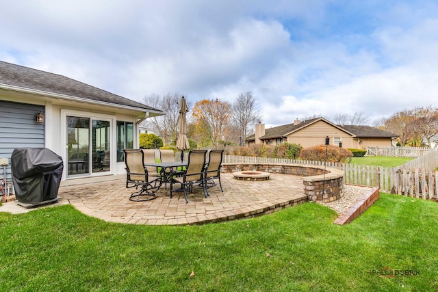 view of yard featuring a patio and a fire pit