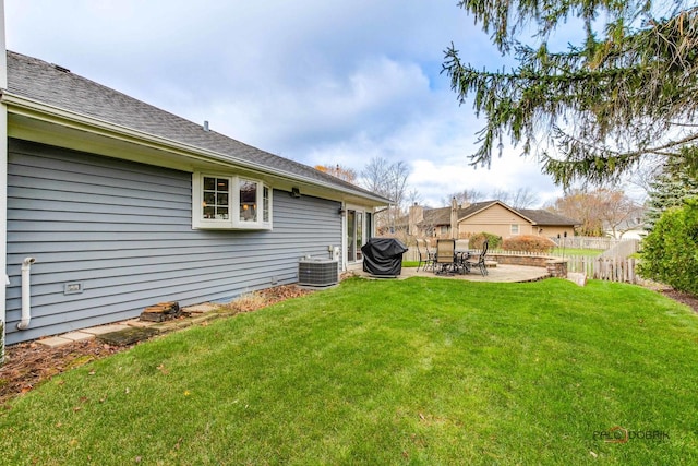 view of yard featuring central AC unit and a patio area