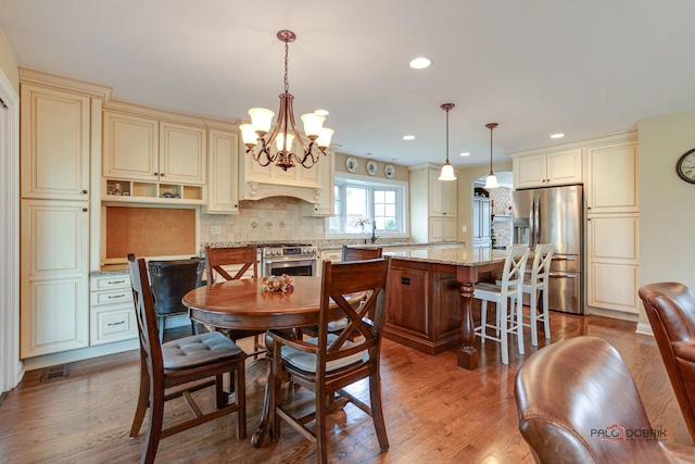 dining room featuring dark hardwood / wood-style floors and a notable chandelier