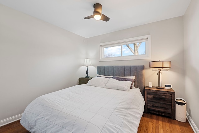 bedroom with ceiling fan and hardwood / wood-style floors