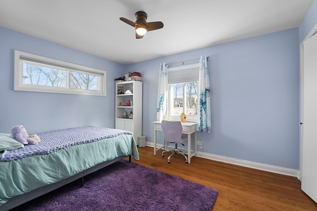 bedroom with ceiling fan and hardwood / wood-style floors