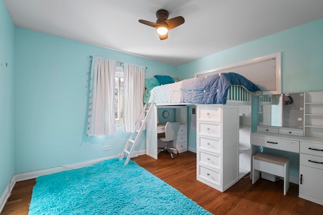 bedroom with dark hardwood / wood-style flooring and ceiling fan