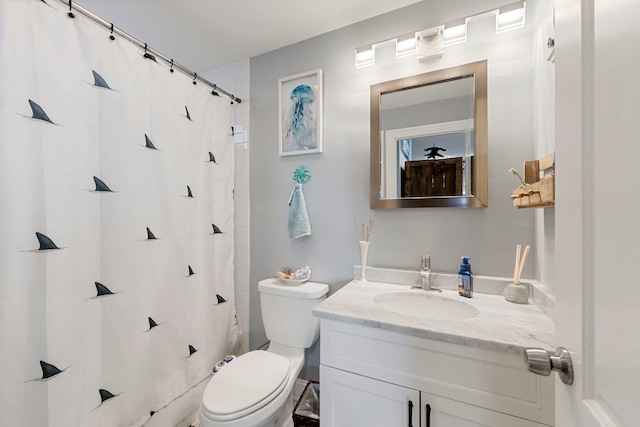 bathroom featuring vanity, walk in shower, and toilet