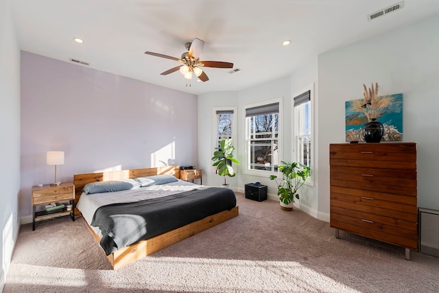 carpeted bedroom featuring ceiling fan