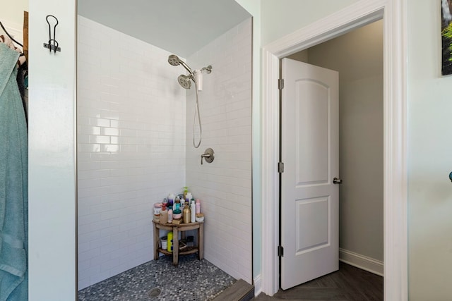 bathroom with a tile shower