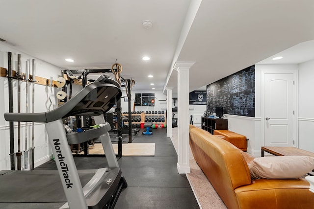 exercise room featuring ornate columns