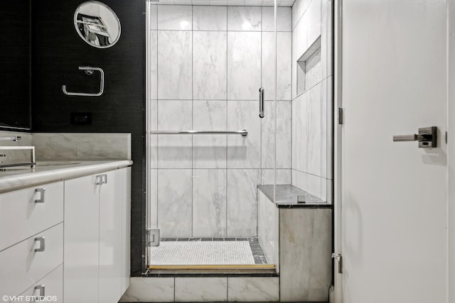 bathroom featuring vanity and an enclosed shower