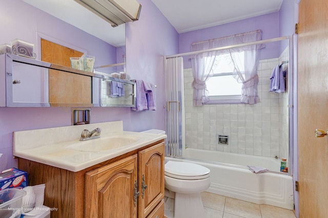 full bathroom with vanity, toilet, tile patterned floors, and tiled shower / bath