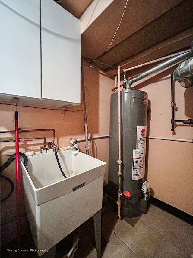 utilities featuring sink and water heater