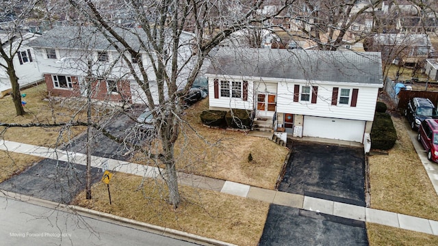 bi-level home featuring a garage