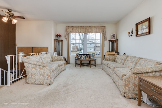 living room featuring carpet floors and ceiling fan