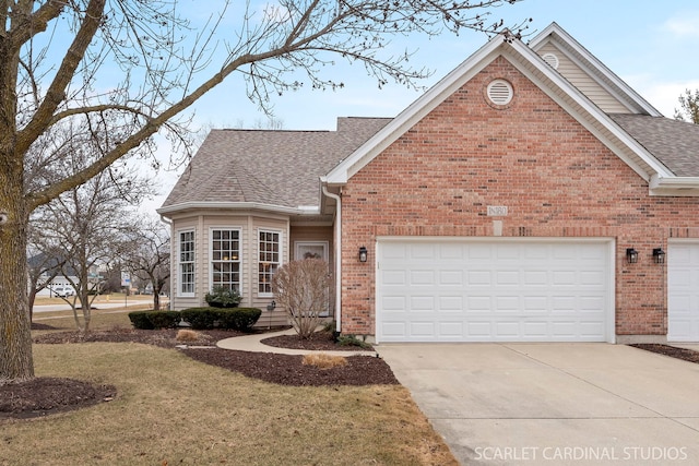 view of front of home featuring a garage and a front yard