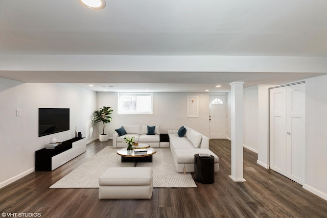 living room with dark hardwood / wood-style floors