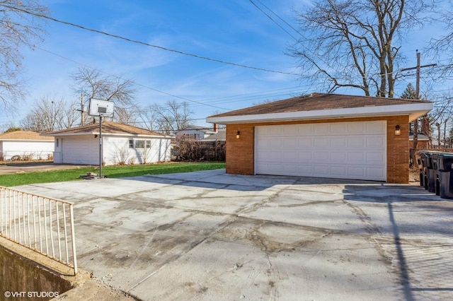 exterior space with a garage and an outdoor structure