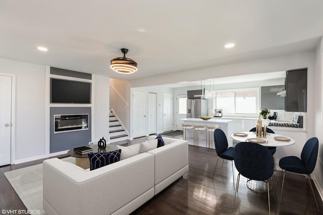 living room featuring dark hardwood / wood-style flooring