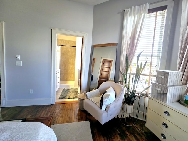 sitting room with a healthy amount of sunlight and dark hardwood / wood-style floors