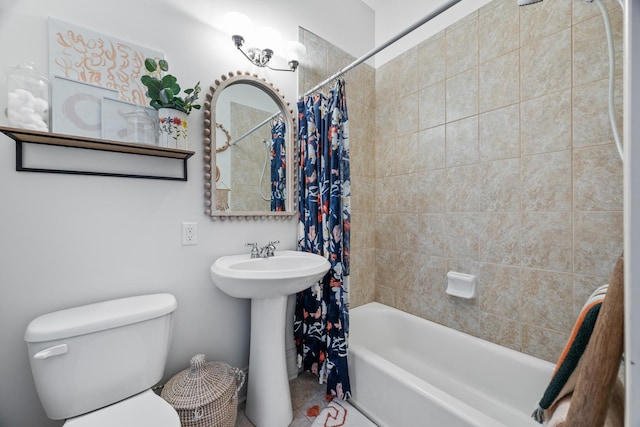 full bathroom with tile patterned flooring, sink, shower / tub combo with curtain, and toilet