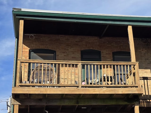 back of house with a balcony