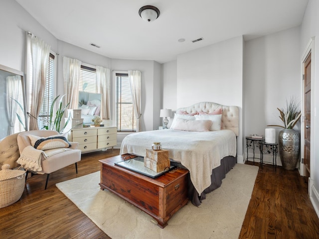 bedroom featuring dark hardwood / wood-style flooring