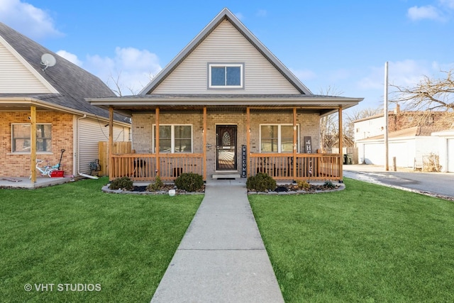 view of front of property with a porch and a front lawn