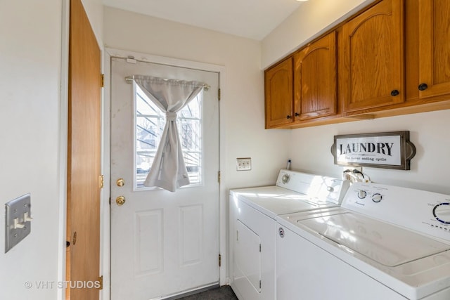 laundry room featuring cabinets and separate washer and dryer