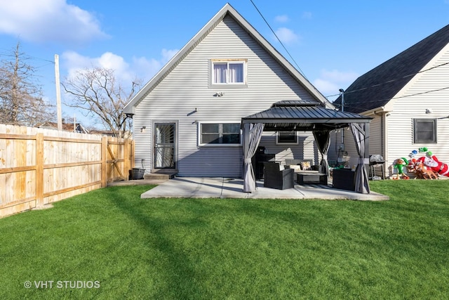 back of house with a gazebo, outdoor lounge area, a lawn, and a patio area