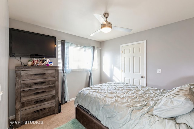 bedroom with ceiling fan and carpet flooring