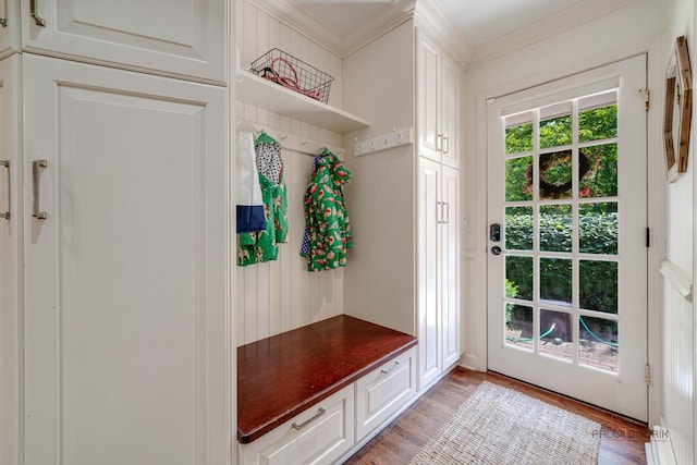 mudroom featuring crown molding and light hardwood / wood-style flooring