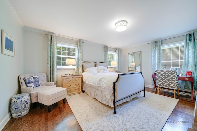 bedroom featuring hardwood / wood-style floors and ornamental molding