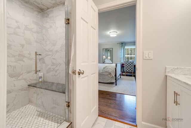 bathroom with walk in shower, ornamental molding, and vanity