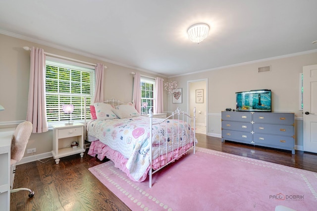 bedroom featuring crown molding and dark hardwood / wood-style floors