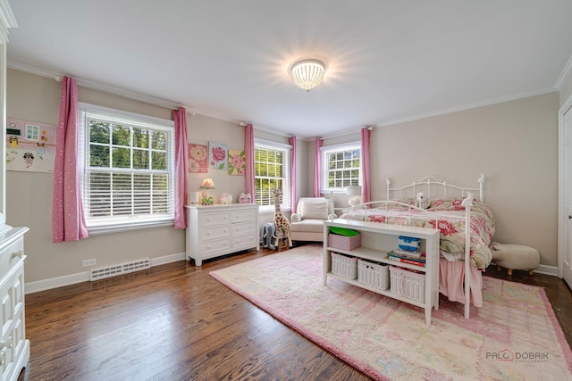 bedroom with ornamental molding and dark hardwood / wood-style floors