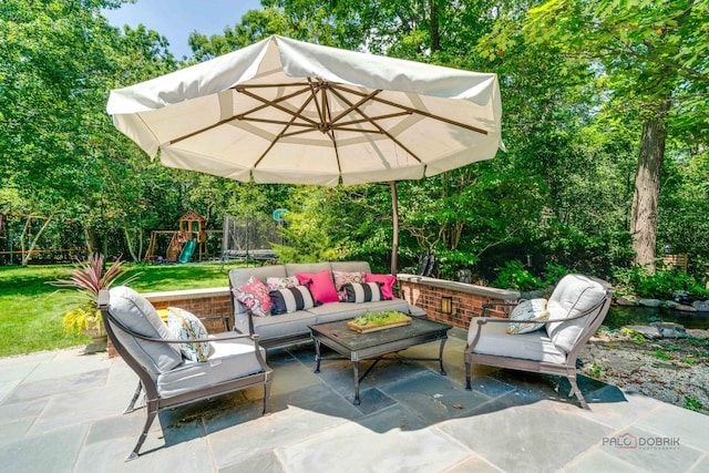 view of patio / terrace featuring a playground and an outdoor hangout area