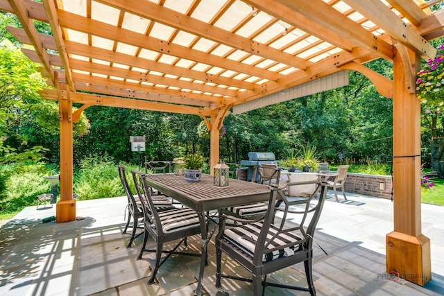 view of patio featuring a grill and a pergola