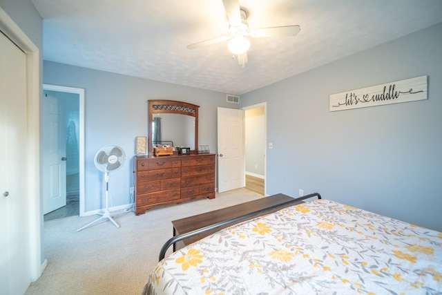 bedroom with ceiling fan and light colored carpet