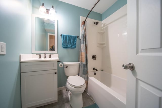 full bathroom with vanity, shower / tub combo with curtain, and toilet