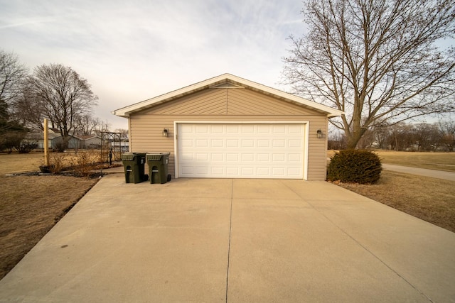 view of garage at dusk