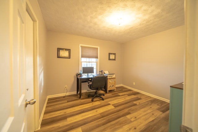 office area featuring a textured ceiling and dark hardwood / wood-style flooring