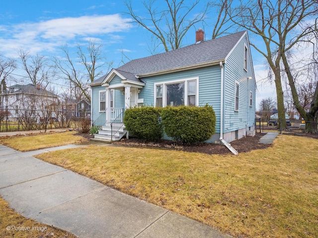 bungalow-style house with a front yard