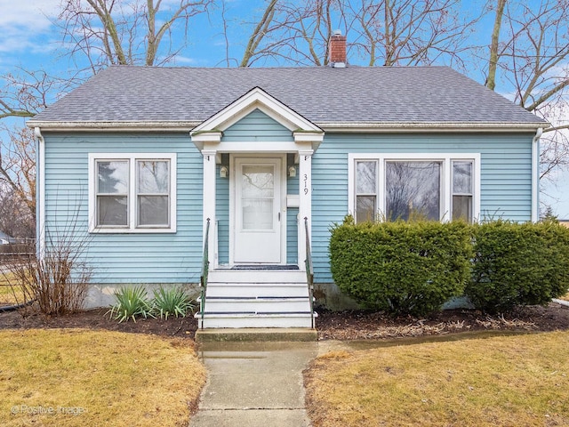 view of front of house with a front lawn