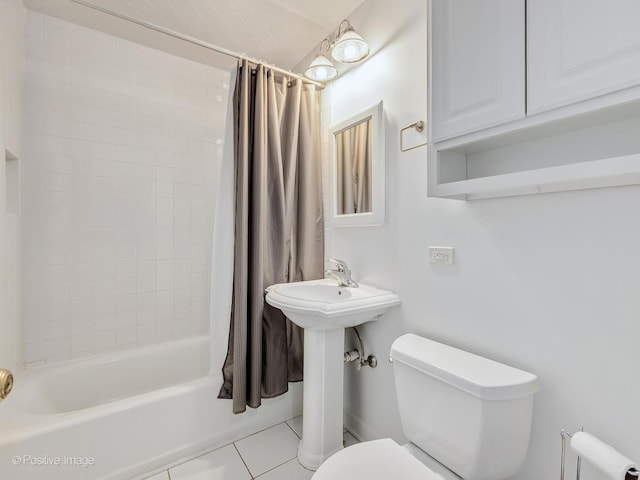 bathroom featuring shower / bath combo, tile patterned floors, and toilet