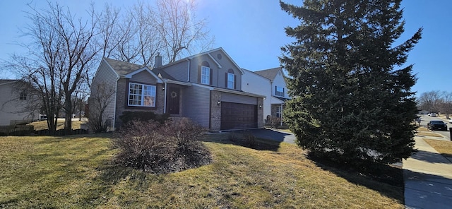 traditional-style home featuring brick siding, a front lawn, a chimney, a garage, and driveway